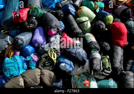 Munich, Germany. 12th Sep, 2015. Many donated sleeping bags are collected close to the train station in Munich, Germany, 12 September 2015. Due to a lack of refugee shelters, volunteers ask for donated sleeping bags and mats. Photo: Sven Hoppe/dpa/Alamy Live News Stock Photo