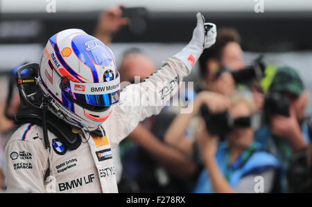 Oschersleben, Germany. 13th Sep, 2015. Swedish-british winner Tom Blomqvist celebrates his win at the DTM German Touring Car Championship in the etropolis arena in Oschersleben, Germany, 13 September 2015. PHOTO: JENS WOLF/DPA/Alamy Live News Stock Photo