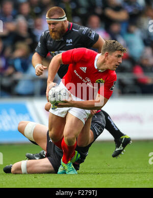 Swansea, Wales. 13th Sep, 2015. Guinness Pro12. Ospreys versus Munster Rugby. Munster's Ian Keatley gets tackled. © Action Plus Sports/Alamy Live News Stock Photo
