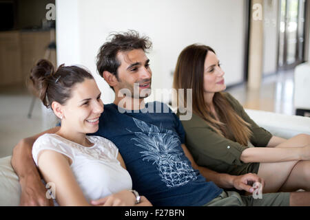 Young people watching tv Stock Photo