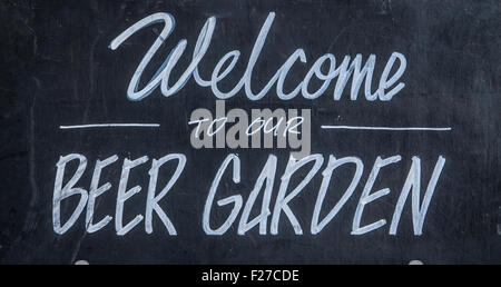 A Blackboard Sign Outside A Bar Or Pub Saying Welcome To Our Beer Garden Stock Photo