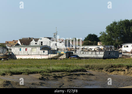 Houseboats on the mudflats on the banks of the river Adur in Shoreham West Sussex.