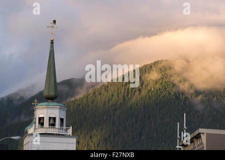 Bald eagle sitting on top of the steeple of St. Michael's Cathedral in Sitka, Alaska. Stock Photo