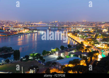 Golden Horn at night Halic in Turkish aerial twilight view with the Istanbul historical peninsula background from Pierre Loti Stock Photo