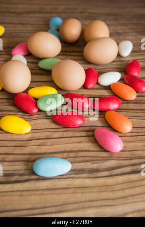 Close-up of easter eggs with colourful candies Stock Photo