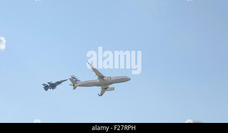 Athens, Greece. 13th Sep, 2015. An Aegean Airlines Airbus A320 files together with an HAF F16 Block 52  member of the 'Zeus' Demo Team during the second day of |Athens Flying Week. Credit:  George Panagakis/Pacific Press/Alamy Live News Stock Photo