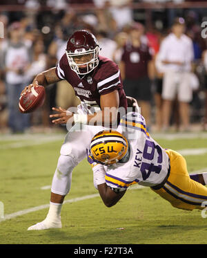 Mississippi State QB, Dak Prescott (8) throw from his own end zone ...