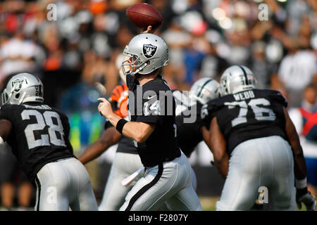 Oakland, California, USA. 13th Sep, 2015. Oakland Raiders quarterback Matt McGloin (14) throws the ball during the NFL game at O.co Coliseum. The Cincinnati Bengals defeated the Oakland Raiders with a score of 33-13.  Credit:  Stan Szeto/Cal Sport Media/Alamy Live News Stock Photo