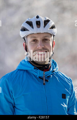 Portrait of mountain biker smiling, Bavaria, Germany Stock Photo