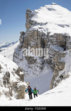 Ski mountaineers climbing on snowy mountain, Val Gardena, Trentino-Alto Adige, Italy Stock Photo