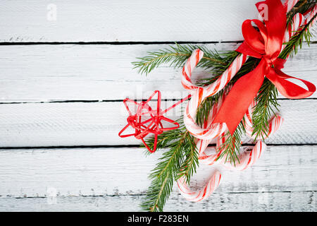 Christmas bouquet made up of candy canes, red star and conifer Stock Photo