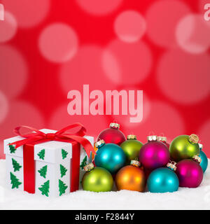 Christmas gifts gift decoration with colorful balls, snow and copyspace Stock Photo