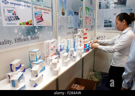 Phnom Penh, Cambodia. 14th Sep, 2015. A saleswoman prepares medical products during a pharmaceutical expo in Phnom Penh, capital of Cambodia, on Sept. 14, 2015. Cambodia organized the first international exhibition on the pharmaceutical and medical industry on Monday in a bid to boost the development of this fledgling sector, officials said. © Sovannara/Xinhua/Alamy Live News Stock Photo