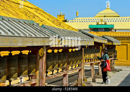 Buddhist visitor turningp rayer mills in the Buddhist Gandan Monastery, Ulaanbaatar, Mongolia Stock Photo