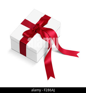 Gift box with long red ribbons and bow isolated on white, path Stock Photo