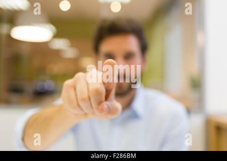 Businessman in office using interactive screen Stock Photo