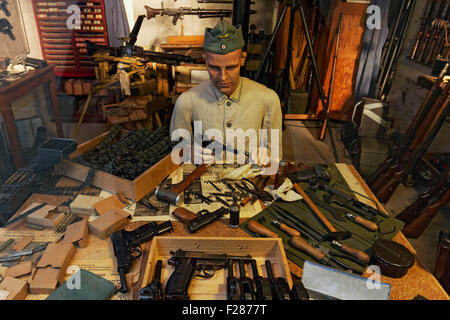 German soldier from the 2nd World War, repairing guns, re-enactment in the open-air museum Atlantic Wall Stock Photo