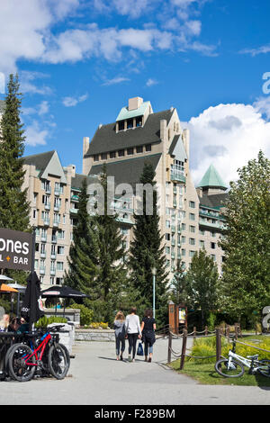 Fairmont Chateau Whistler in Upper (Blackcomb) village in Whistler, BC, Canada.  Summer, people walking, beautiful day. Stock Photo