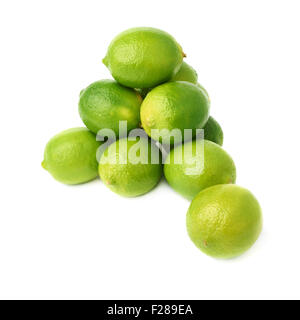 Pile of multiple ripe limes, composition isolated over the white ...