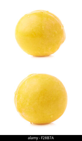 Single yellow mirabelle plum covered with the drops of water, isolated over the white background, set of two different foreshort Stock Photo