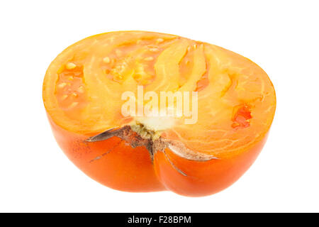 Yellow tomato slice closeup isolated on white background Stock Photo