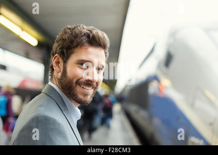 Portrait of cheerful man on platform station. looking camera Stock Photo
