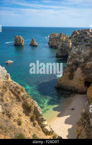 Vertical cliffside view of an empty beach in Portugal's Algarve. Stock Photo