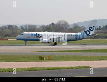 Flybe Embraer 175 taking off from Manchester Airport taxiway. Stock Photo