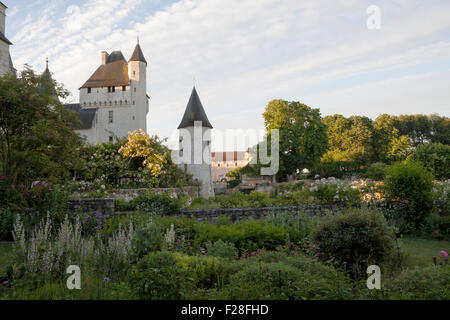 Chateau du Rivau, early morning light with roses and secret garden in foreground Stock Photo