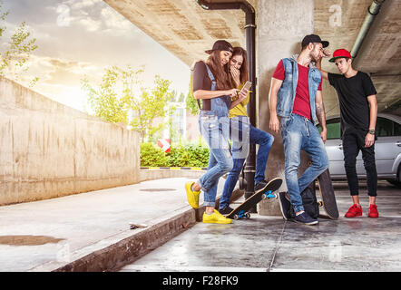 Skateboarder friends in the parking garage Stock Photo