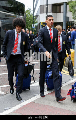 Manchester United's Marouane Fellaini (left), Chris Smalling (centre) & Luke Shaw (right) arrive at Manchester airport.