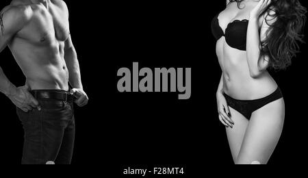 Man and woman's bodies isolated on a black background Stock Photo
