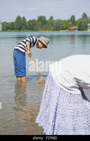 Two friends fishing in the lake, Bavaria, Germany Stock Photo