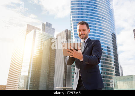 Businessman using a digital tablet Stock Photo
