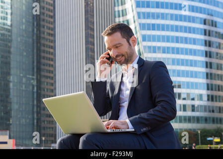 Businessman talking on mobile phone Stock Photo