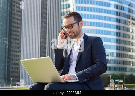 Businessman talking on mobile phone Stock Photo