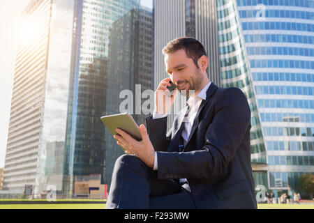 Businessman talking on mobile phone Stock Photo
