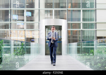 Businessman using a digital tablet Stock Photo