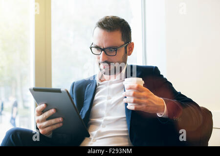Businessman having a coffee break Stock Photo