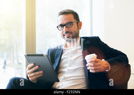 Businessman having a coffee break Stock Photo