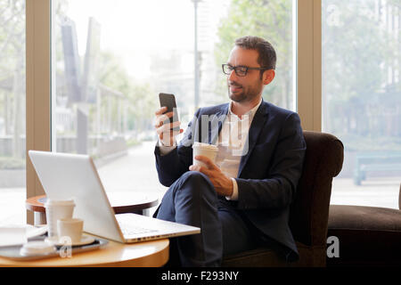 Businessman having a coffee break Stock Photo