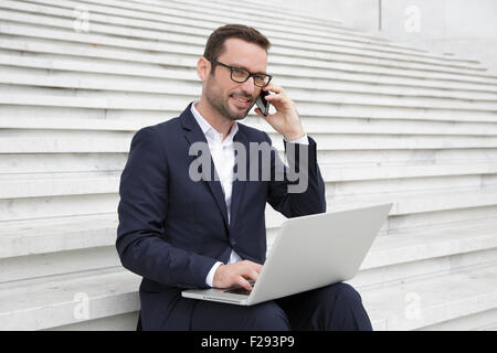 Businessman talking on mobile phone Stock Photo