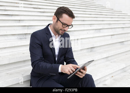 Businessman using a digital tablet Stock Photo