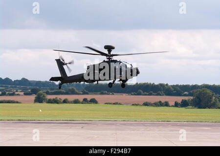 Side view Of A British Army AH MK1 Apache Longbow Helicopter landing Stock Photo