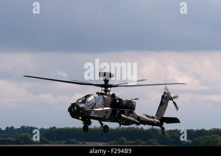 Side view Of A British Army AH MK1 Apache Longbow Helicopter In Flight Stock Photo