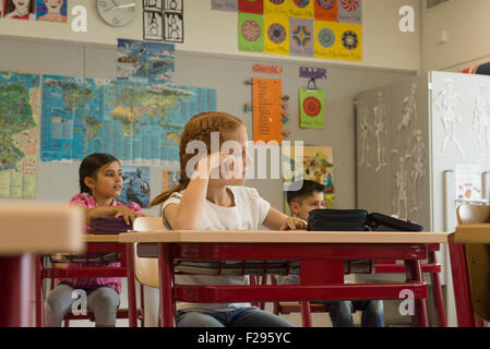 school children dreaming in a classroom, Munich, Bavaria, Germany Stock Photo