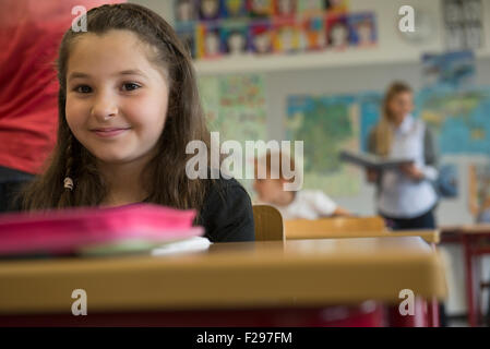 Portrait of a schoolgirl in classroom, Munich, Bavaria, Germany Stock Photo