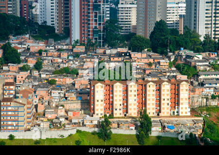 Scenic view of shanty town contrasting with skyscrapers in background, Morumbi neighborhood, Sao Paulo, Brazil. Stock Photo
