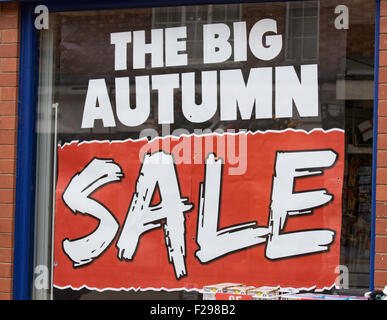 Autumn sale poster in shop window, England, UK Stock Photo