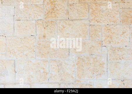 Old and aged pale orange brick wall texture background. Stock Photo